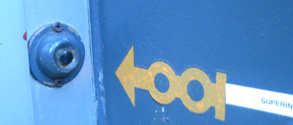 Yellow arrow pointing to a doorbell