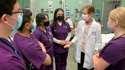 Student huddle with nursing lab instructor (9/30/22)