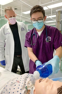 Student with nursing lab instructor